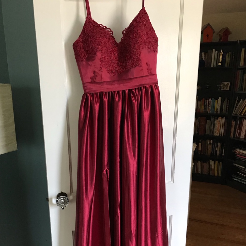 Prom lily satin burgundy prom dress. Lace detail.